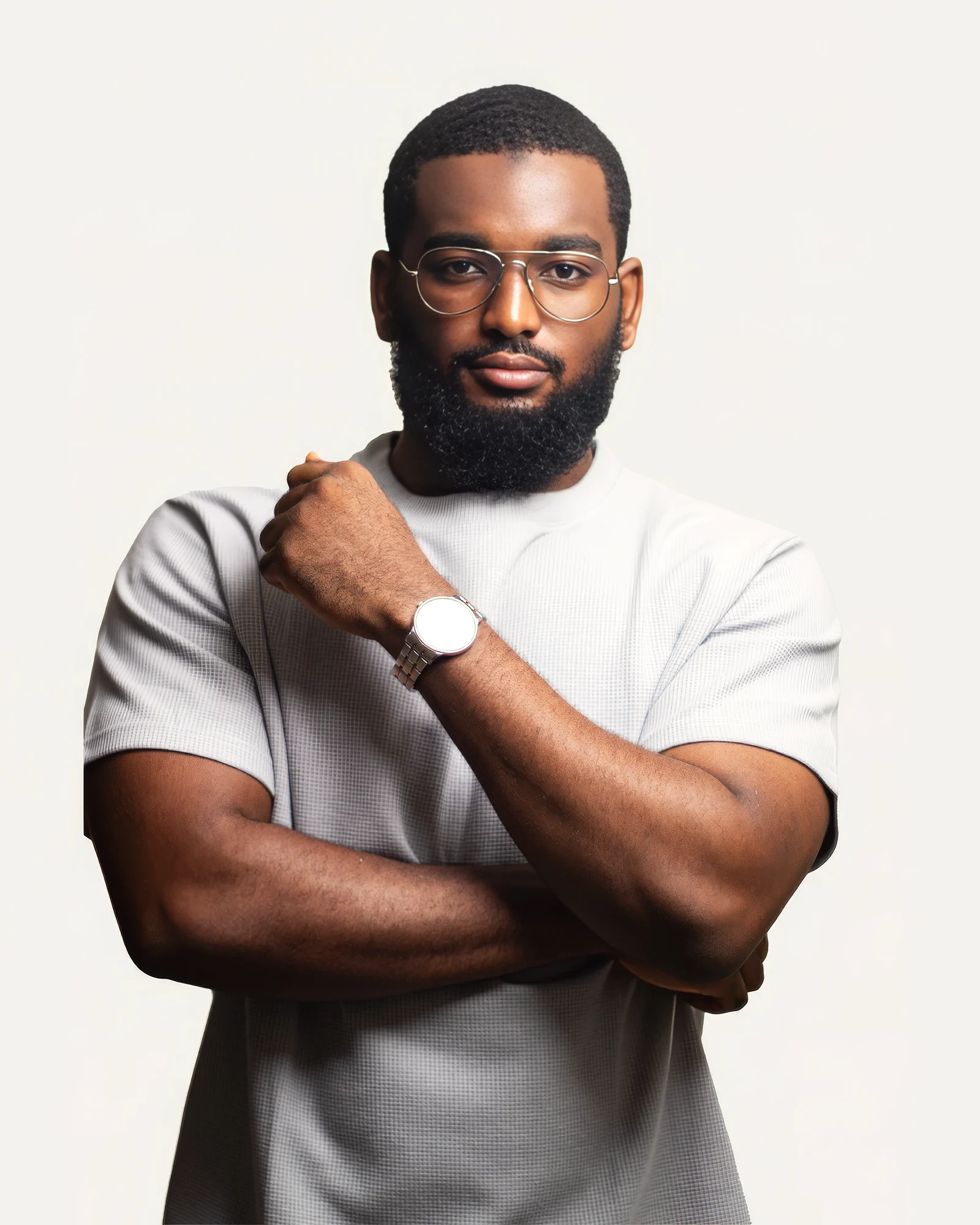 Omar Faruc in a white T-shirt and glasses, arms crossed